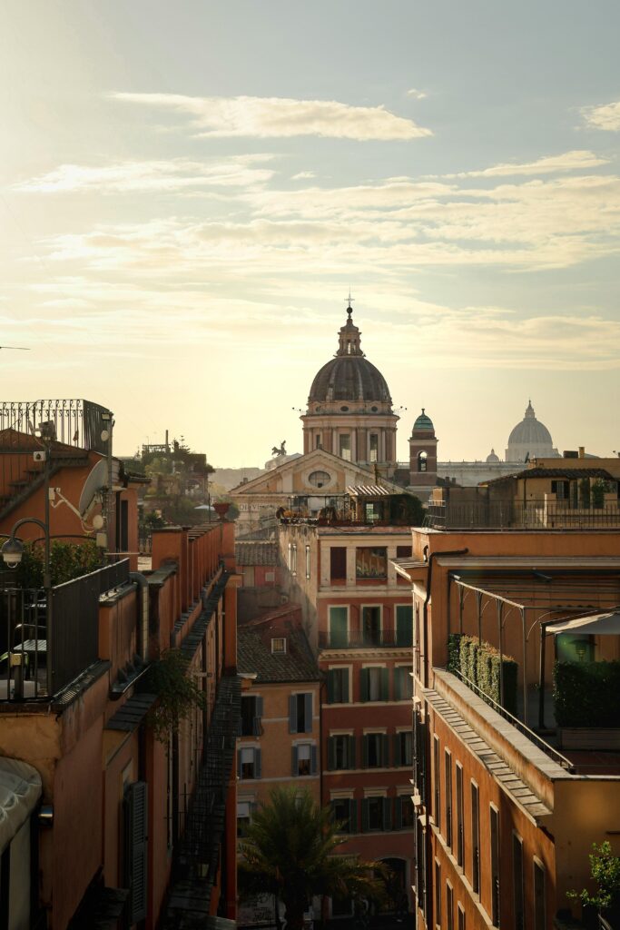 Discover the captivating view of Rome's architecture during a golden sunset, showcasing historic charm.